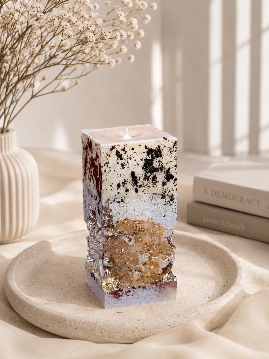Minimalist Handmade Concrete Candle Minimalist square concrete candle with crystal decoration styled in a soft neutral interior with dried flowers.